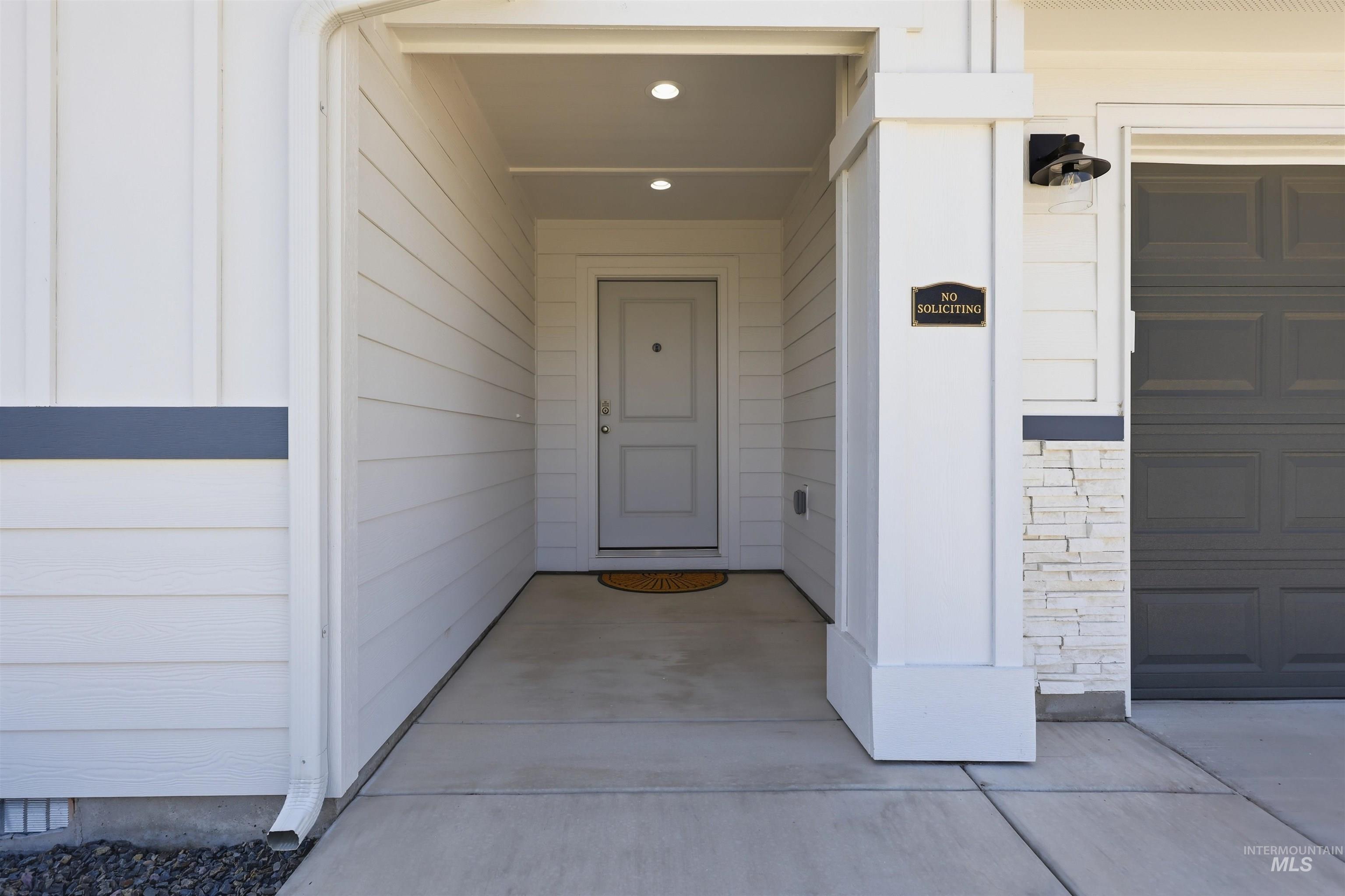 3811 West Maypearl Street Meridian, ID 83642 - Photo 4 of 39 Covered entryway featuring recessed lighting and concrete flooring