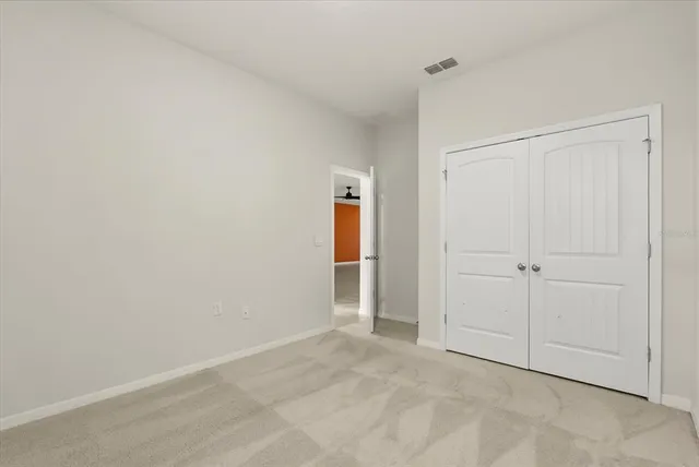 a bathroom with a granite countertop sink toilet tub and shower