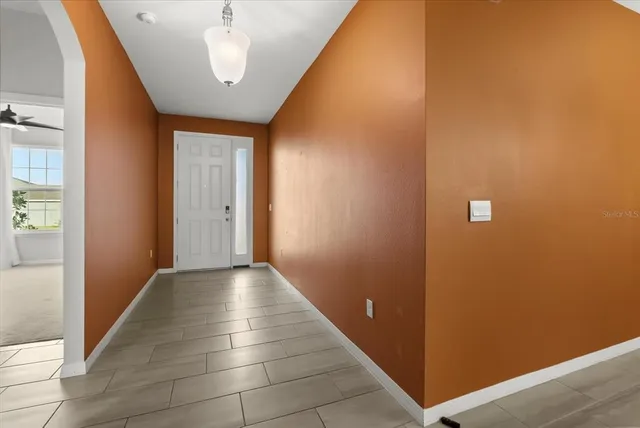 a view of hallway with a couch