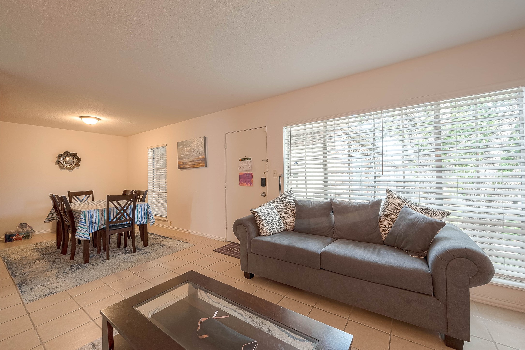 2201 Fountain View Drive, Unit 54 Houston, TX 77057 - Photo 11 of 30 a living room with furniture and a large window