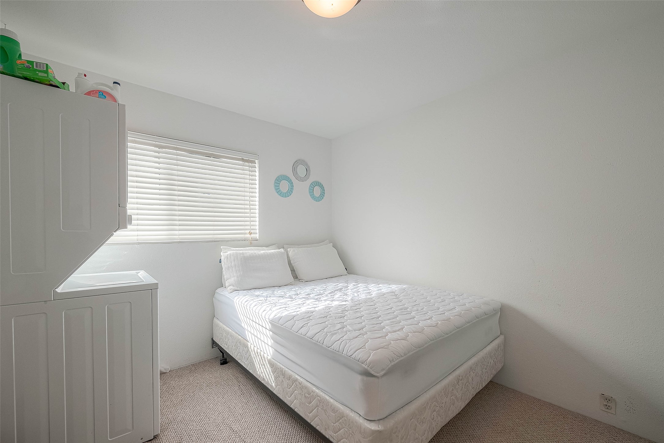 2201 Fountain View Drive, Unit 54 Houston, TX 77057 - Photo 21 of 30 a bedroom with a bed and window