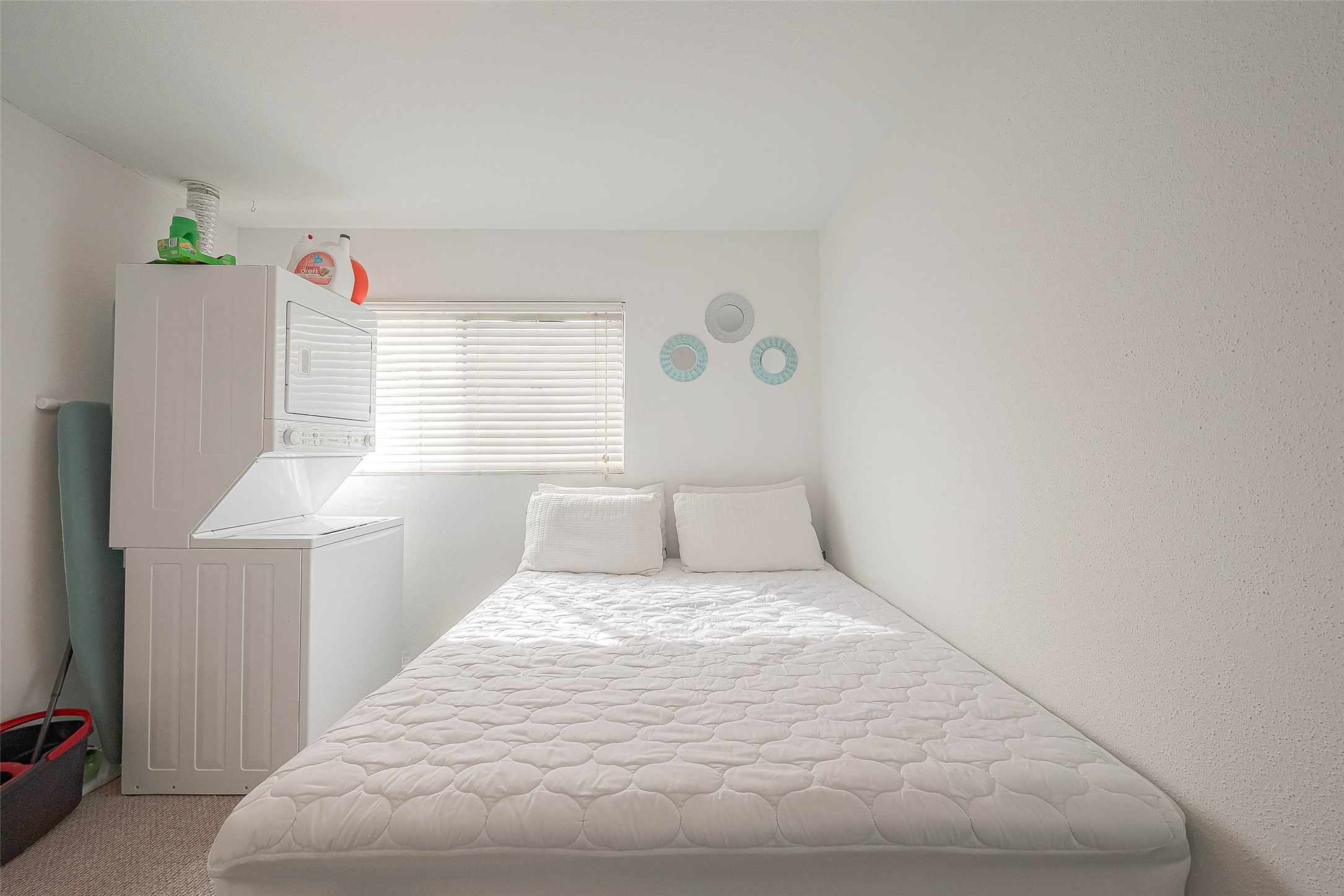 2201 Fountain View Drive, Unit 54 Houston, TX 77057 - Photo 22 of 30 a bedroom with a bed and a window