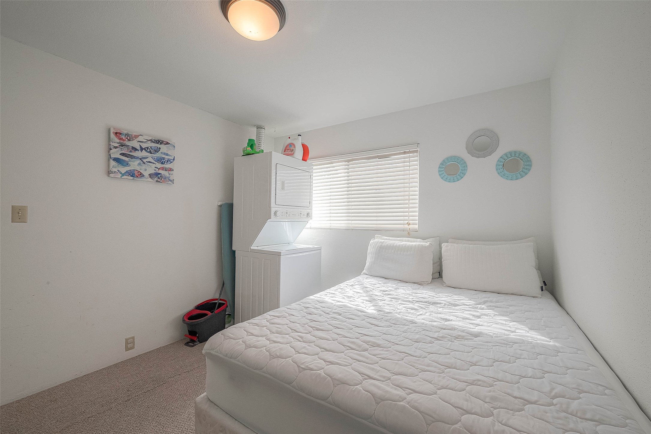 2201 Fountain View Drive, Unit 54 Houston, TX 77057 - Photo 23 of 30 a bedroom with a bed and a window