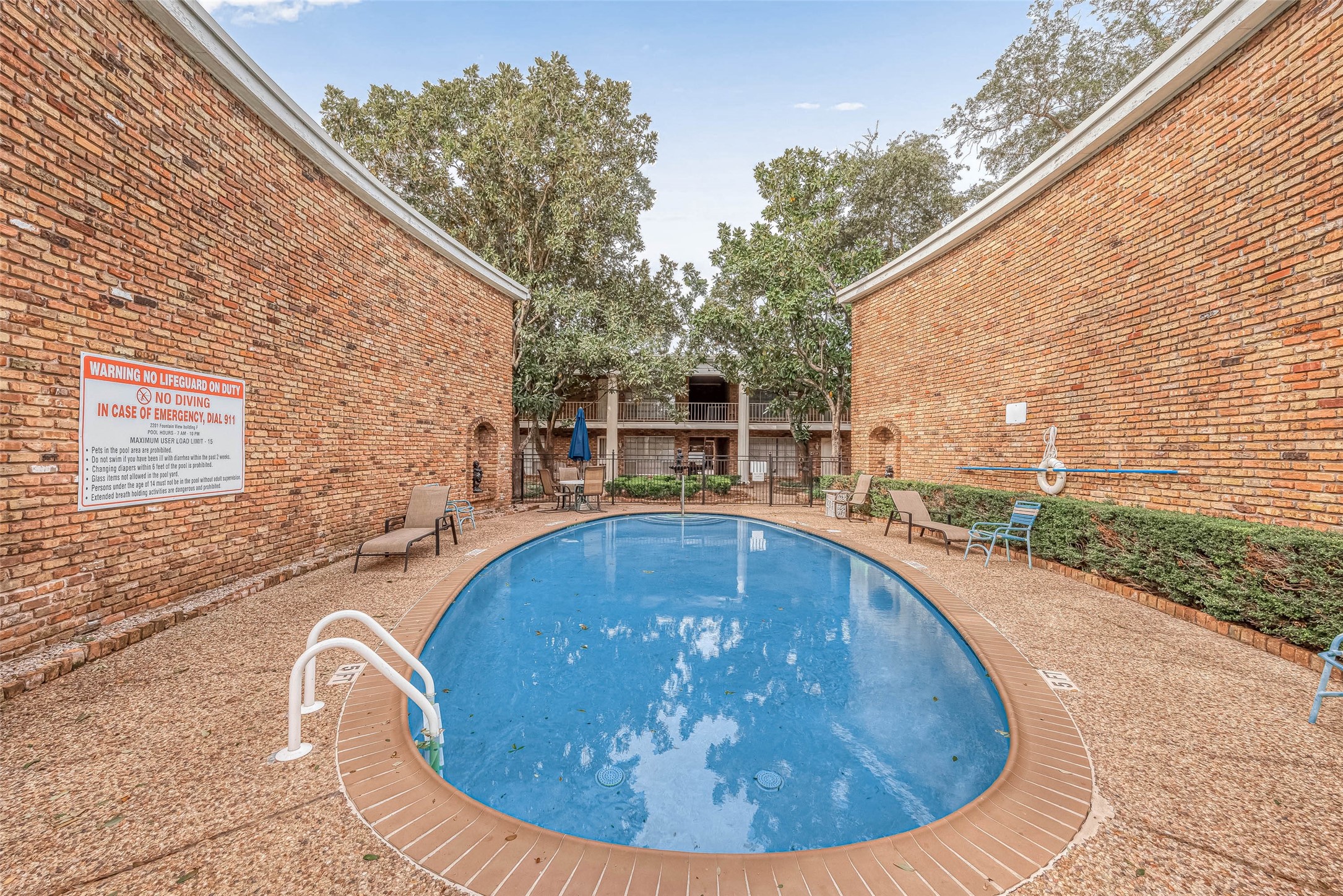 2201 Fountain View Drive, Unit 54 Houston, TX 77057 - Photo 29 of 30 a view of a swimming pool with a patio