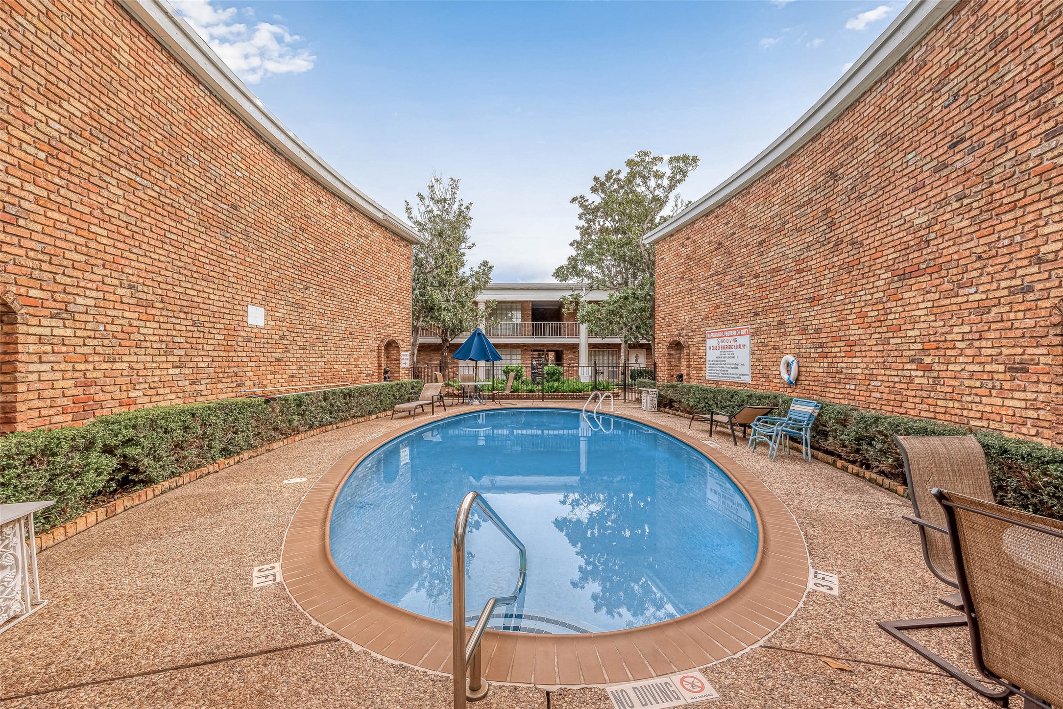 2201 Fountain View Drive, Unit 54 Houston, TX 77057 - Photo 30 of 30 a view of a swimming pool with a patio