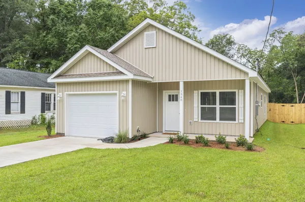 a front view of a house with yard