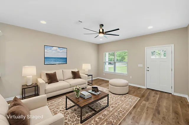 a living room with furniture and a window