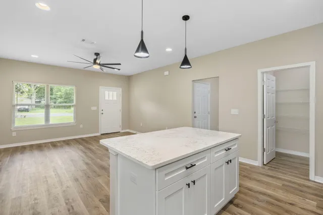 a room with a bed and a chandelier