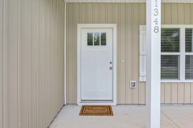 a view of a livingroom with wooden floor and a window