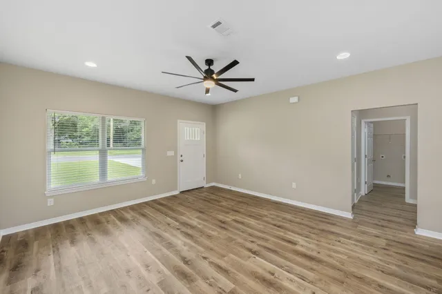 a view of an empty room with a window