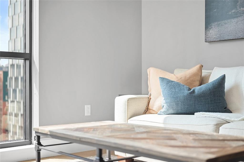 350 Oliver Avenue, Unit 1503 Pittsburgh, PA 15222 - Photo 19 of 43 a bed sitting in a bedroom next to a window