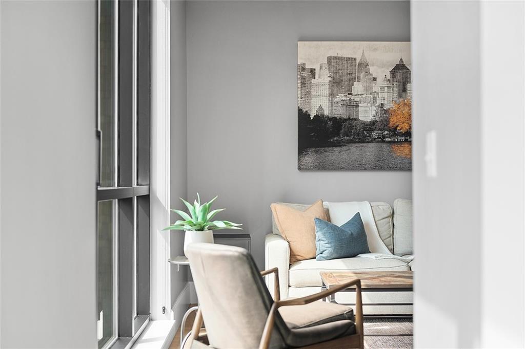 350 Oliver Avenue, Unit 1503 Pittsburgh, PA 15222 - Photo 30 of 43 a view of a balcony with furniture and wooden floor