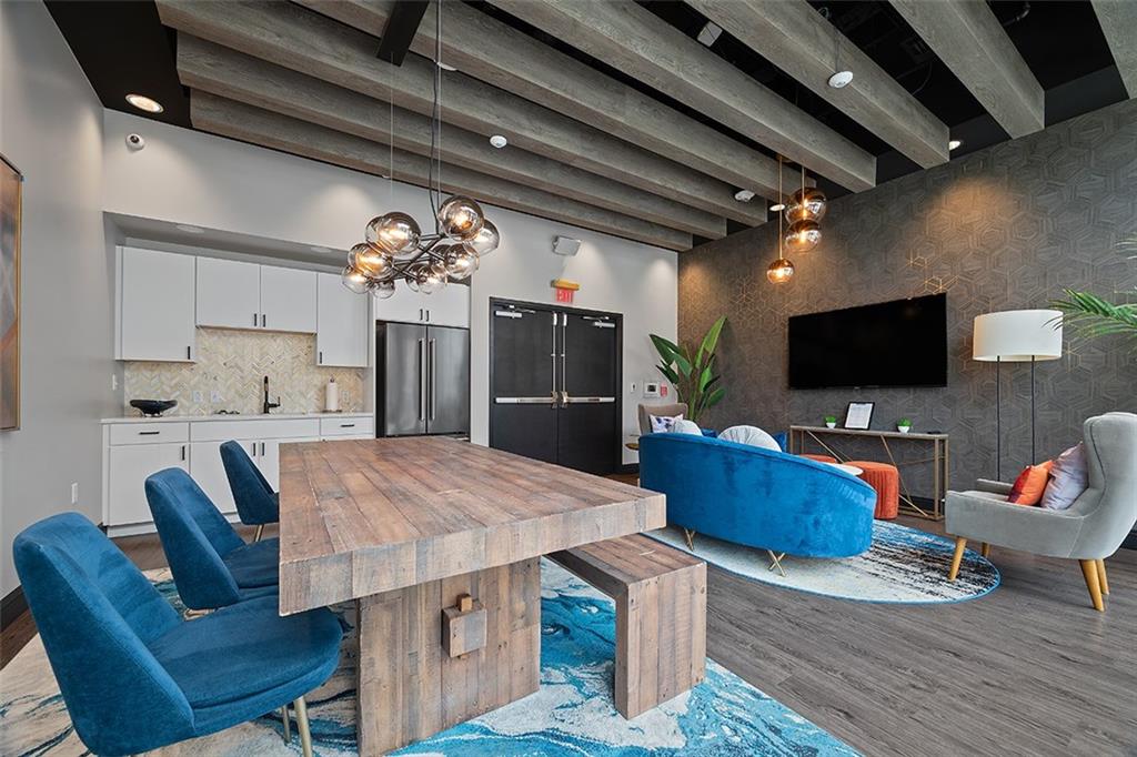 350 Oliver Avenue, Unit 1503 Pittsburgh, PA 15222 - Photo 32 of 43 a view of a dining room with furniture and wooden floor