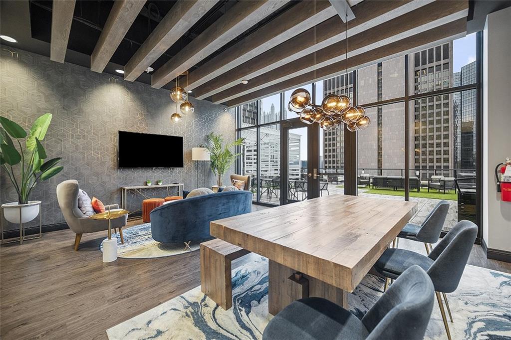 350 Oliver Avenue, Unit 1503 Pittsburgh, PA 15222 - Photo 33 of 43 a view of a dining room with furniture wooden floor and chandelier