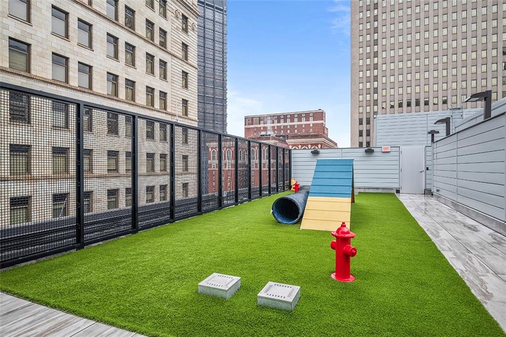 350 Oliver Avenue, Unit 1503 Pittsburgh, PA 15222 - Photo 43 of 43 a view of a backyard with plants and wooden fence