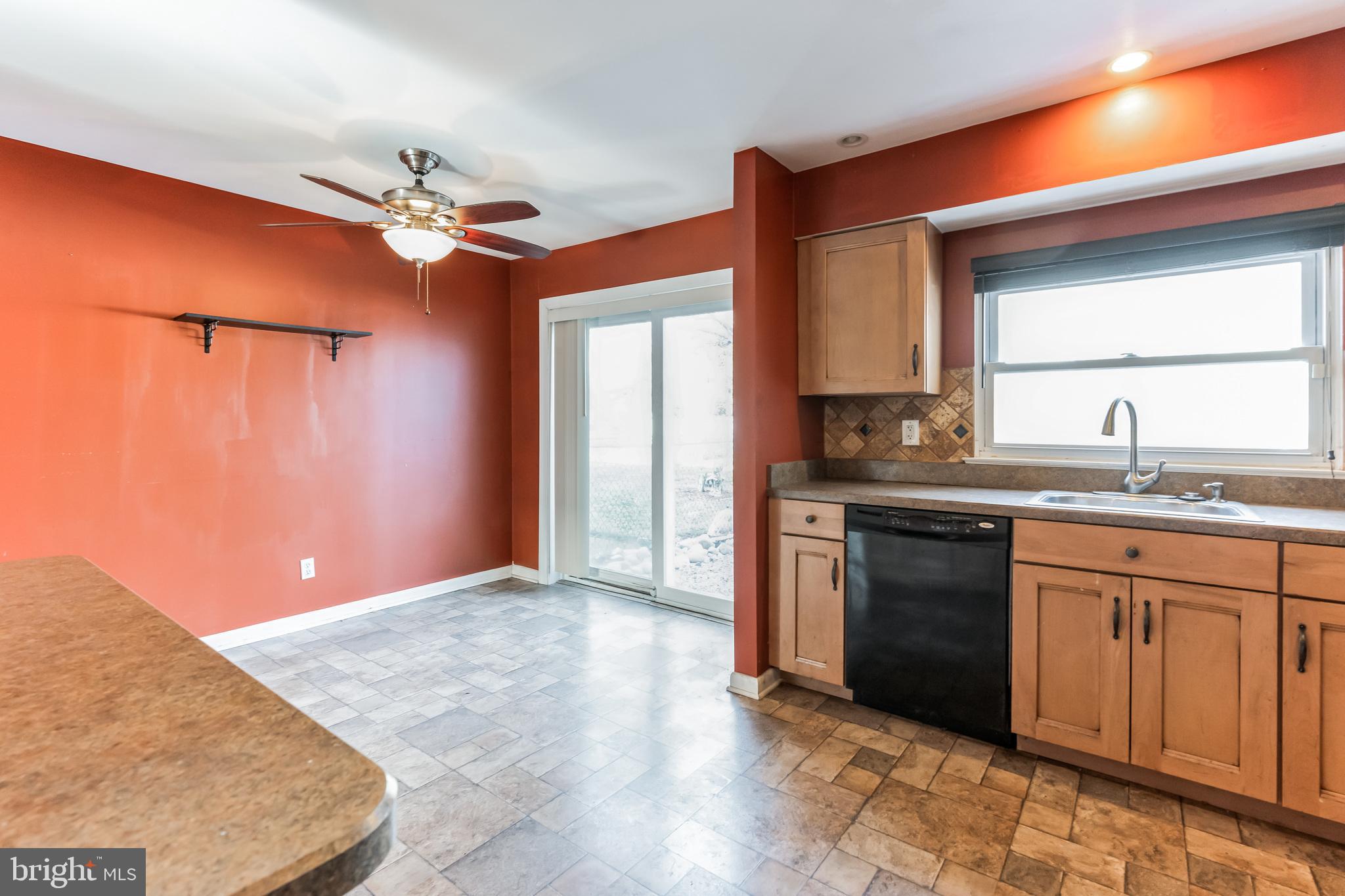 3214 Morning Glory Road Philadelphia, PA 19154 - Photo 11 of 29 a kitchen with stainless steel appliances granite countertop a sink cabinets and a wooden floor