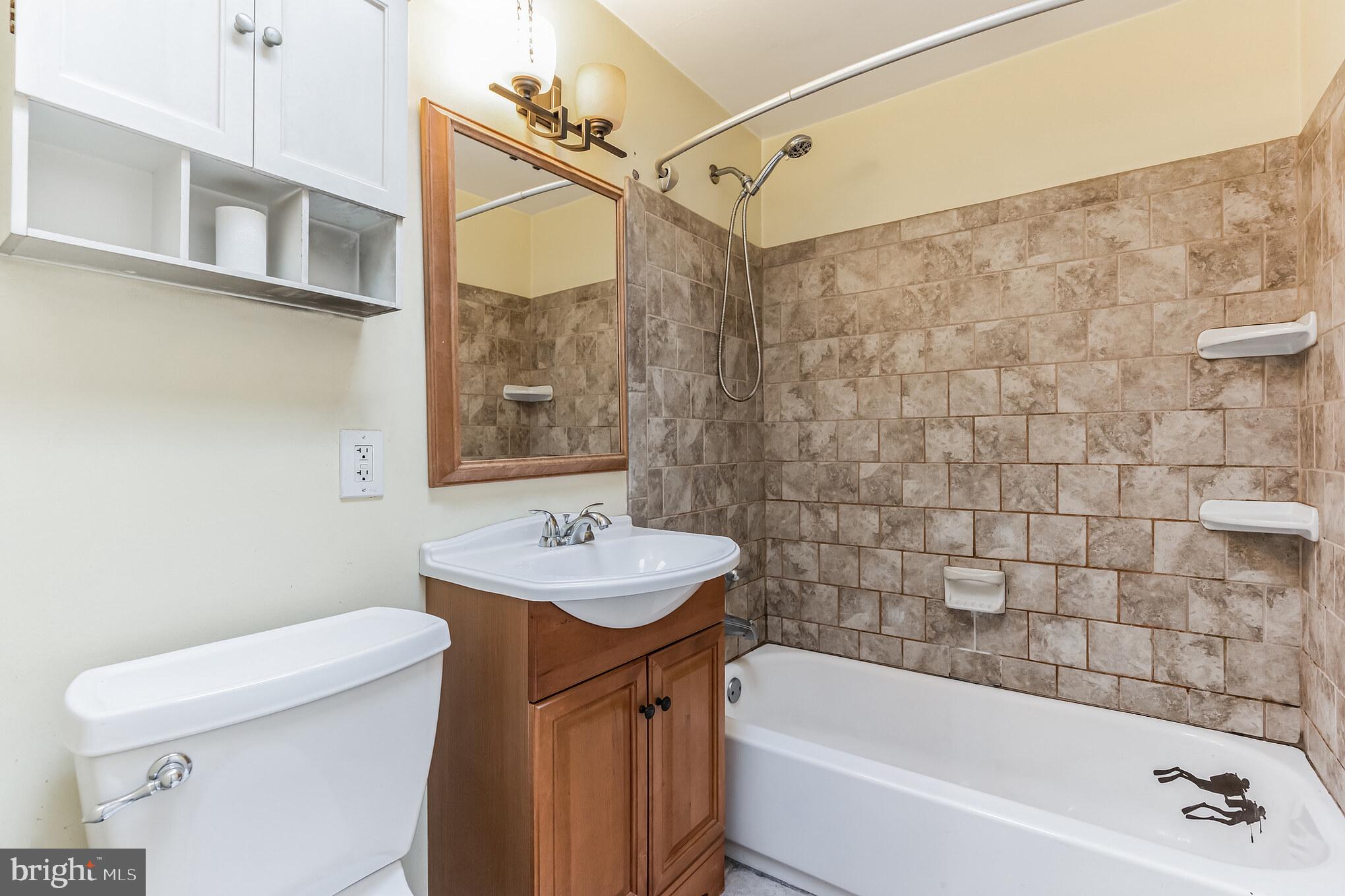 3214 Morning Glory Road Philadelphia, PA 19154 - Photo 15 of 29 a bathroom with a sink a toilet and shower