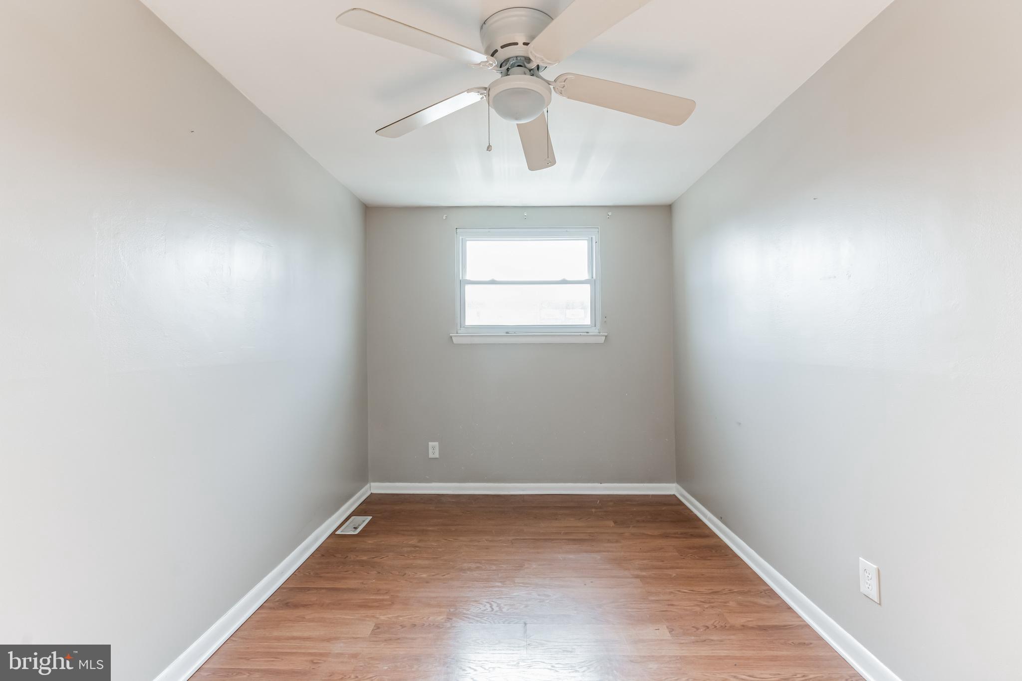 3214 Morning Glory Road Philadelphia, PA 19154 - Photo 21 of 29 an empty room with a window and a chandelier fan
