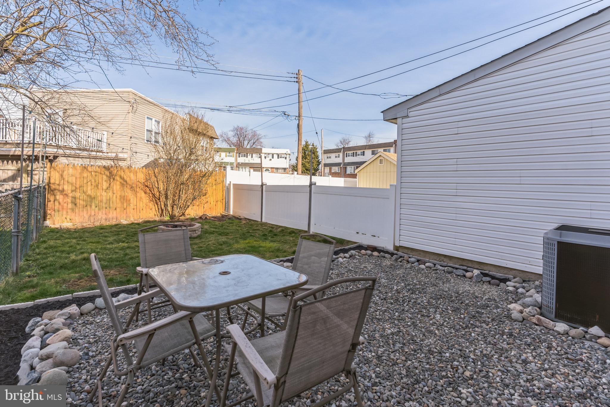 3214 Morning Glory Road Philadelphia, PA 19154 - Photo 28 of 29 a view of a patio with table and chairs and wooden fence