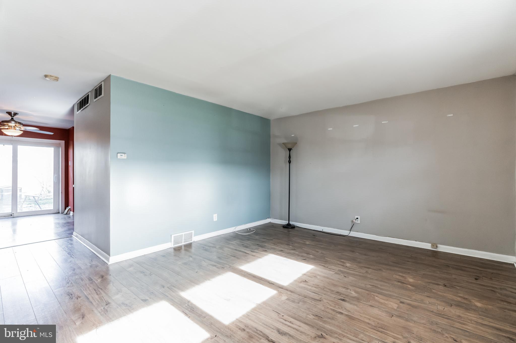 3214 Morning Glory Road Philadelphia, PA 19154 - Photo 3 of 29 a view of an empty room with wooden floor and a window