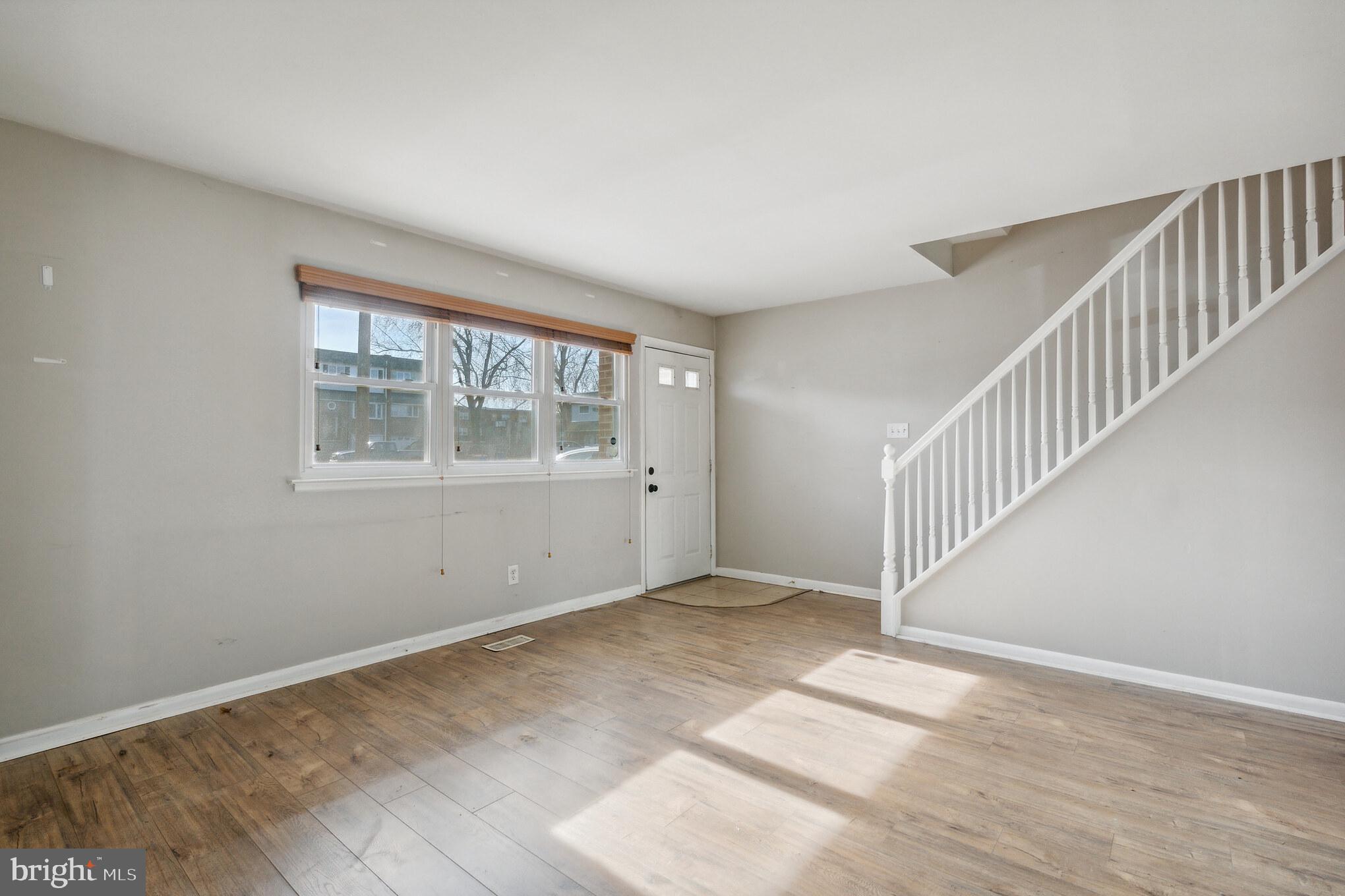 3214 Morning Glory Road Philadelphia, PA 19154 - Photo 5 of 29 a view of an empty room with wooden floor and a window