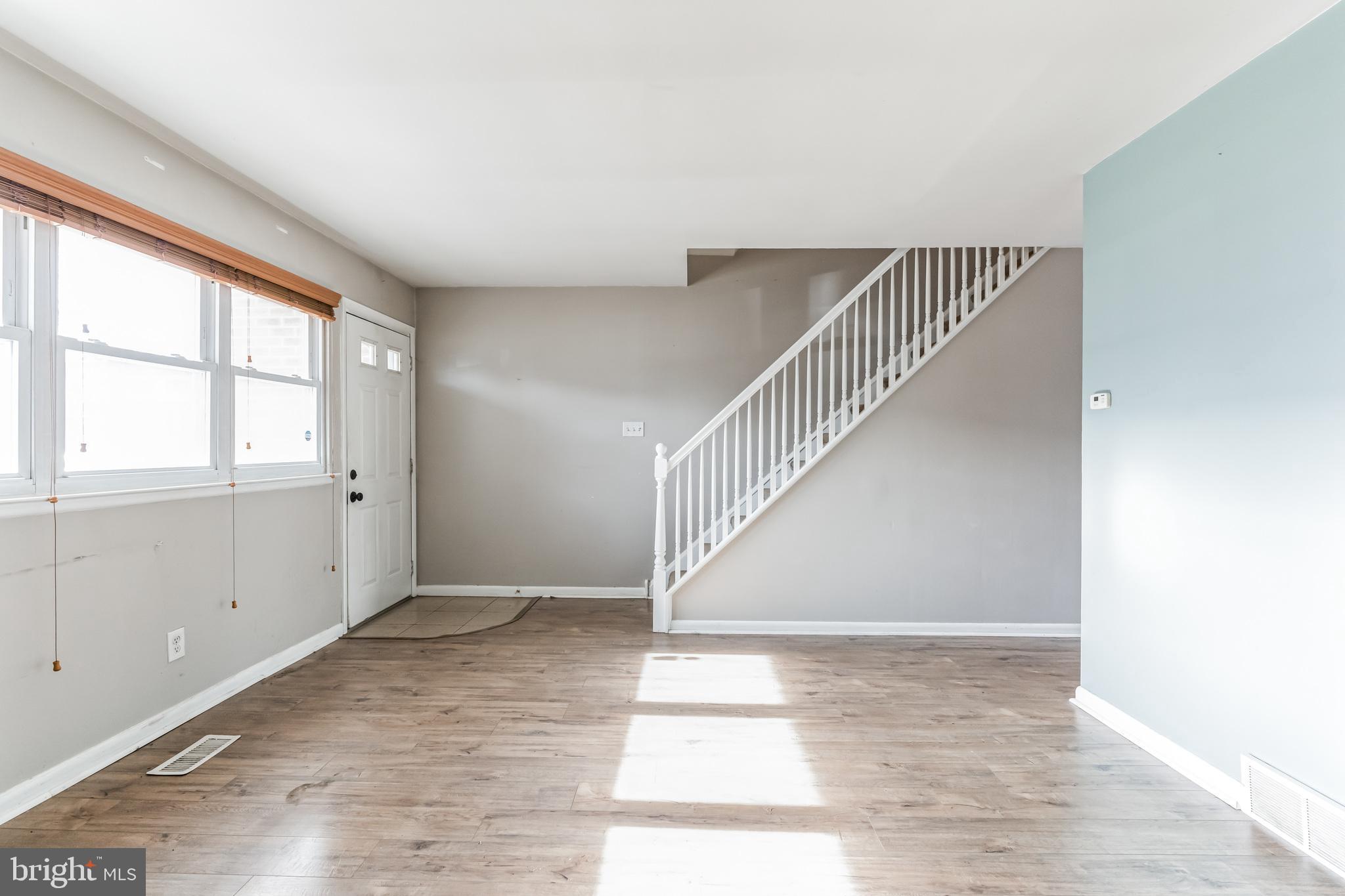 3214 Morning Glory Road Philadelphia, PA 19154 - Photo 6 of 29 a view of an empty room with wooden floor and windows