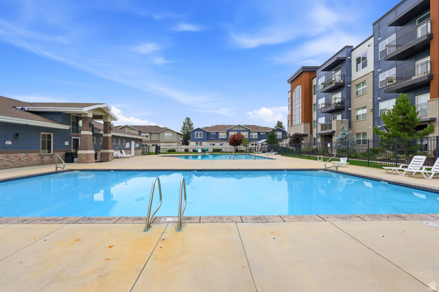 116 East Resaca Drive, Unit F6 Sandy, UT 84070 - Photo 31 of 32 Community swimming pool with concrete decking