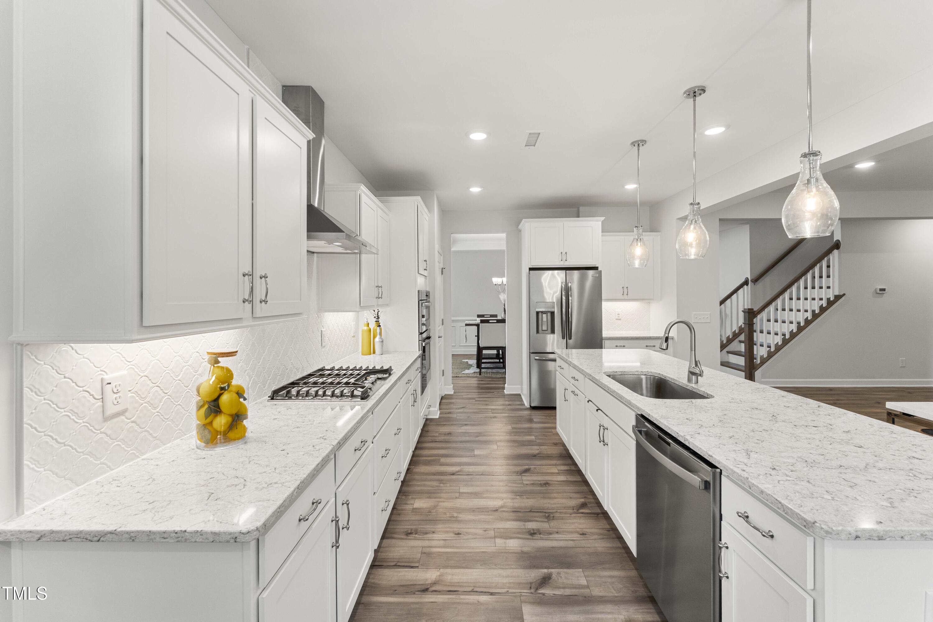 205 Morningside Lane Angier, NC 27501 - Photo 13 of 46 a large kitchen with stainless steel appliances lots of counter top space