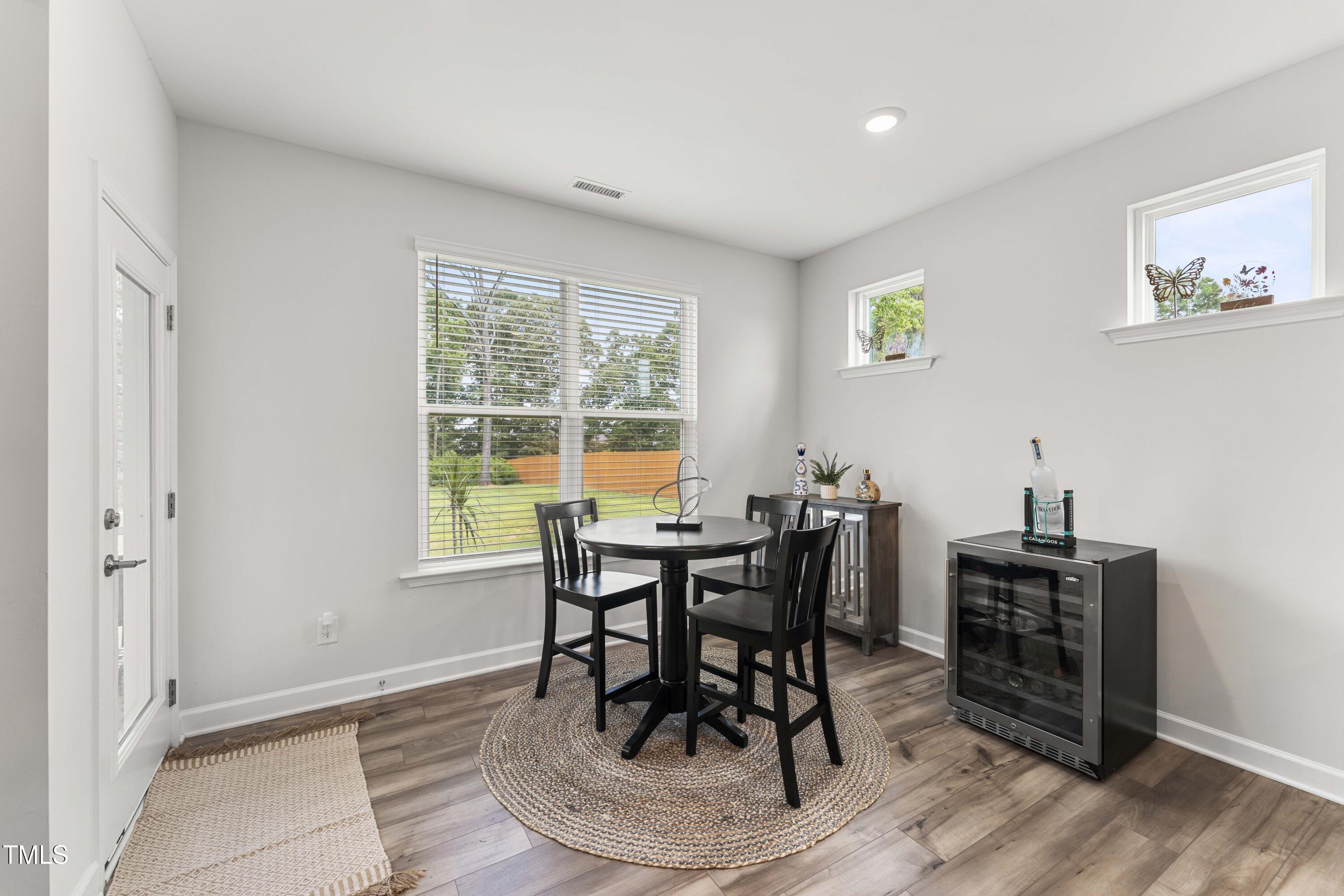 205 Morningside Lane Angier, NC 27501 - Photo 19 of 46 a view of a dining room with furniture and wooden floor