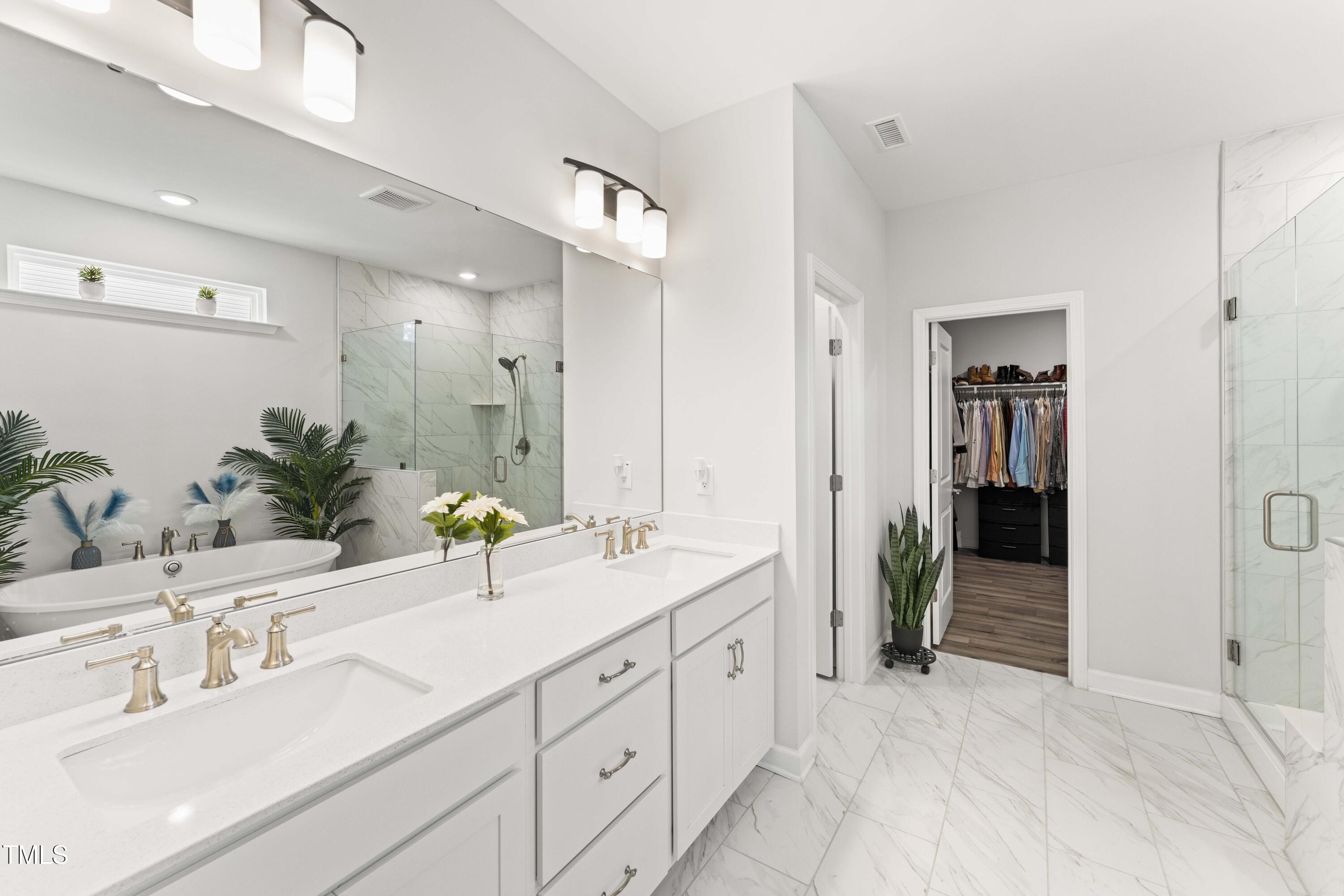 205 Morningside Lane Angier, NC 27501 - Photo 24 of 46 a bathroom with double sink and a mirror