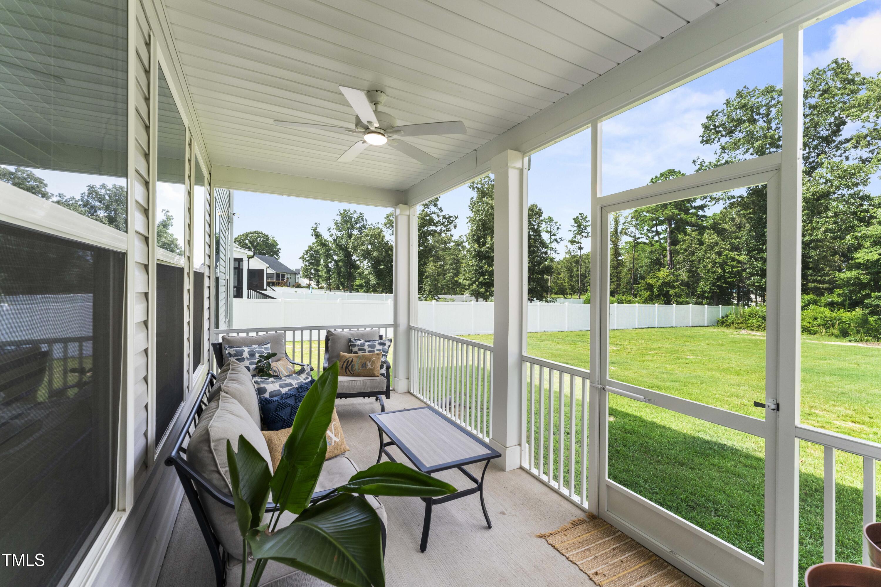 205 Morningside Lane Angier, NC 27501 - Photo 38 of 46 a view of a porch with furniture and garden