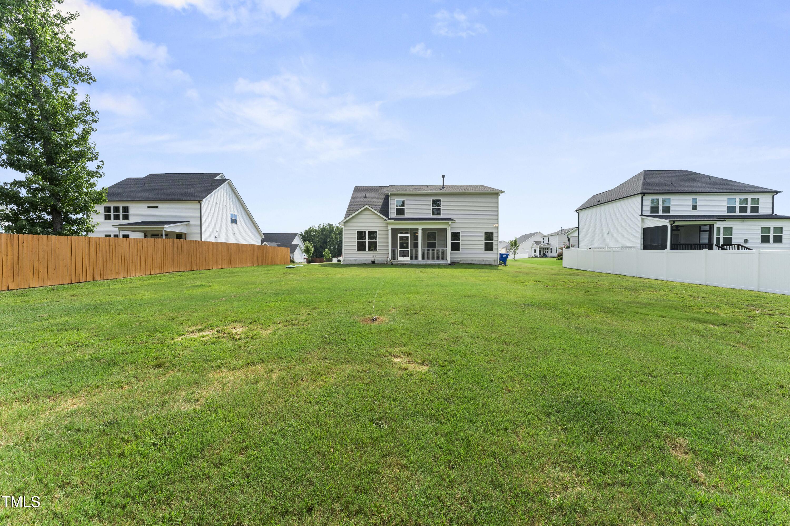 205 Morningside Lane Angier, NC 27501 - Photo 42 of 46 a view of a house with a big yard and large trees