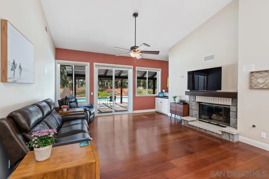 15928 Cumberland Drive Poway, CA 92064 - Photo 11 of 41 a living room with furniture a flat screen tv and a fireplace