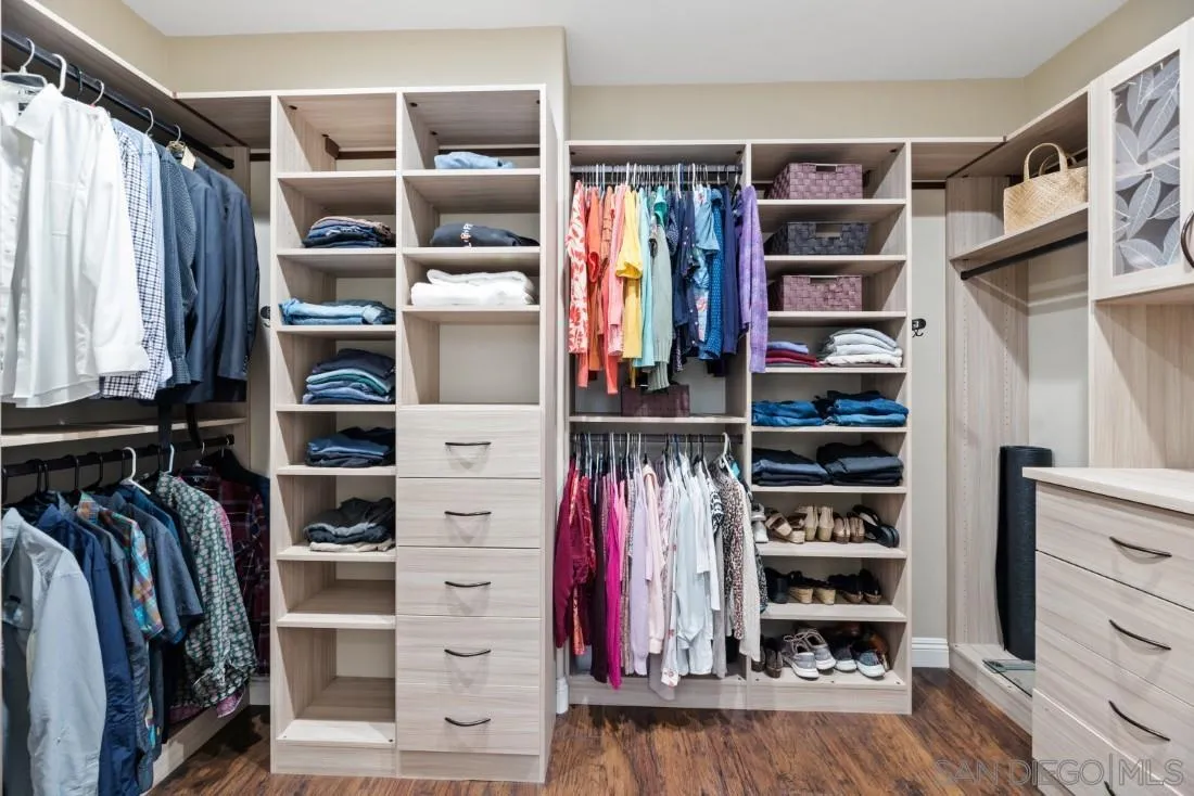 15928 Cumberland Drive Poway, CA 92064 - Photo 24 of 41 a view of walk in closet with clothes and shoes