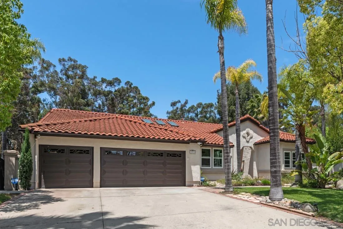 15928 Cumberland Drive Poway, CA 92064 - Photo 4 of 41 a front view of a house with a garden
