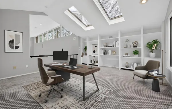 a view of a workspace with furniture