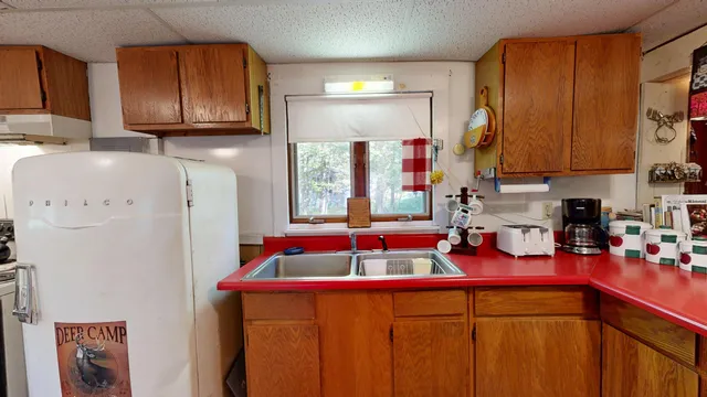 $220,000 | 166 Bemis Road, Oquossoc, ME 04964