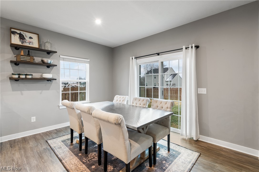 524 Oliver Way Rittman, OH 44270 - Photo 16 of 33 Dining area featuring wood-type flooring and plenty of natural light