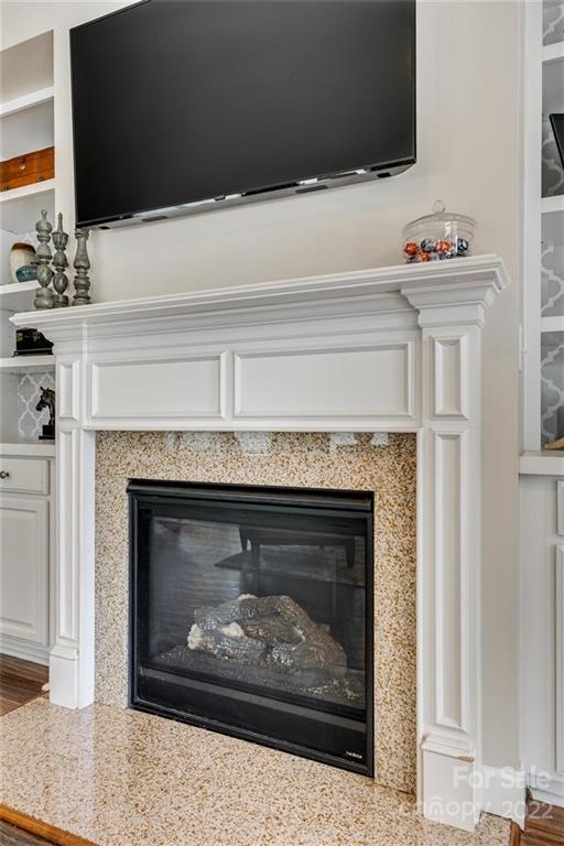 1007 Kaiser Way Fort Mill, SC 29715 - Photo 19 of 48 a fireplace with a clock on top of it