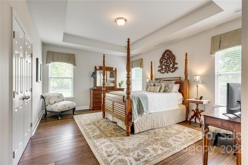 1007 Kaiser Way Fort Mill, SC 29715 - Photo 20 of 48 a bedroom with a bed and wooden floor