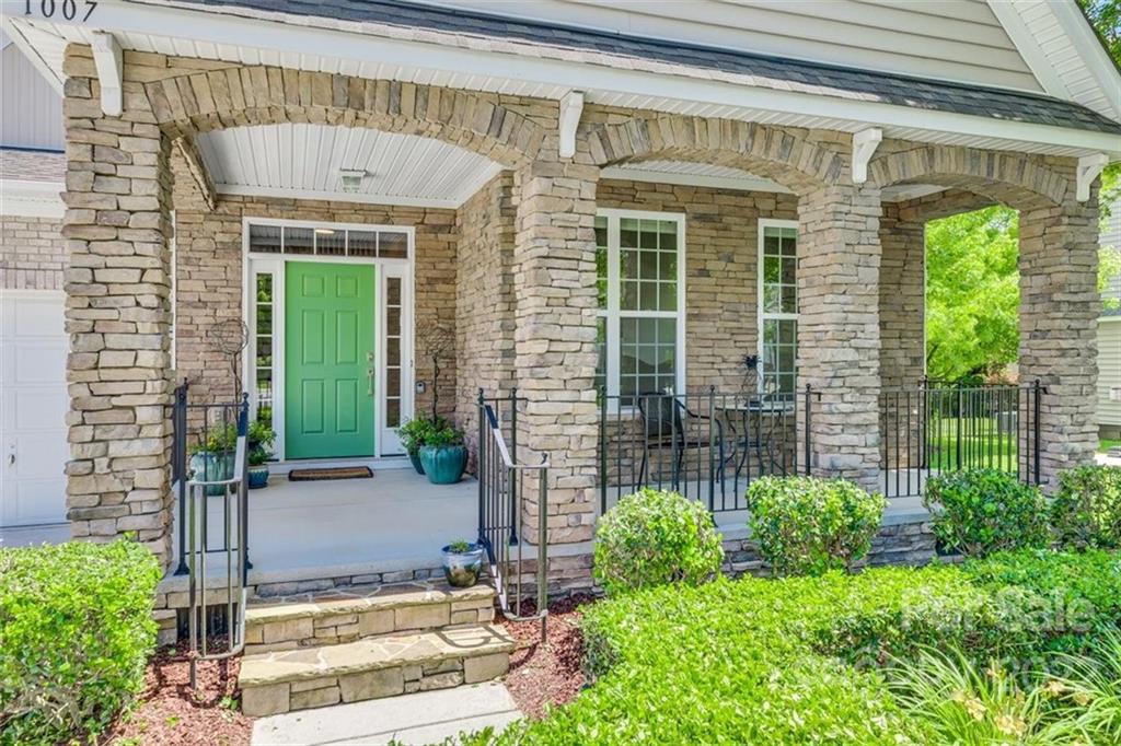 1007 Kaiser Way Fort Mill, SC 29715 - Photo 2 of 48 a front view of a house with a garden