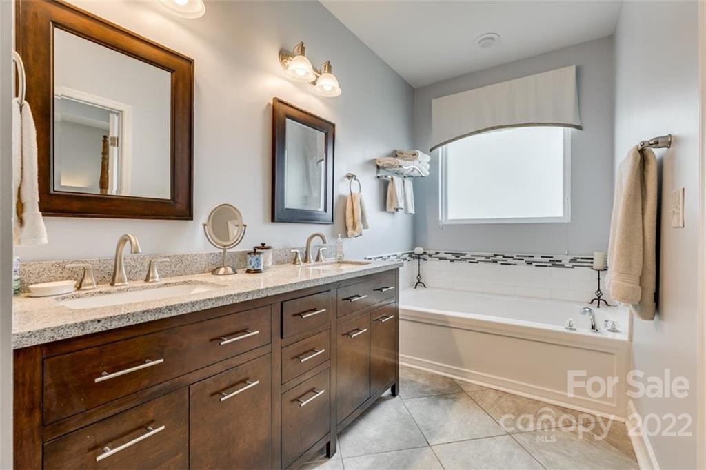 1007 Kaiser Way Fort Mill, SC 29715 - Photo 23 of 48 a bathroom with a tub sink and mirror