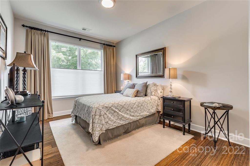 1007 Kaiser Way Fort Mill, SC 29715 - Photo 27 of 48 a bedroom with a bed and a table in it