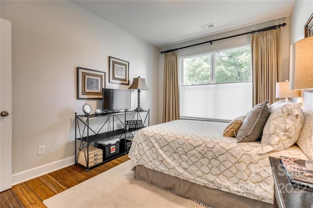 1007 Kaiser Way Fort Mill, SC 29715 - Photo 29 of 48 a bedroom with a bed painting on the wall and a window
