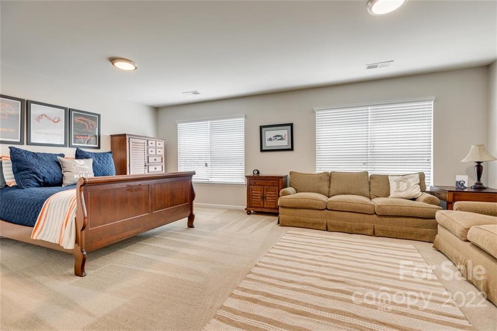 1007 Kaiser Way Fort Mill, SC 29715 - Photo 33 of 48 a bedroom with furniture and a couch