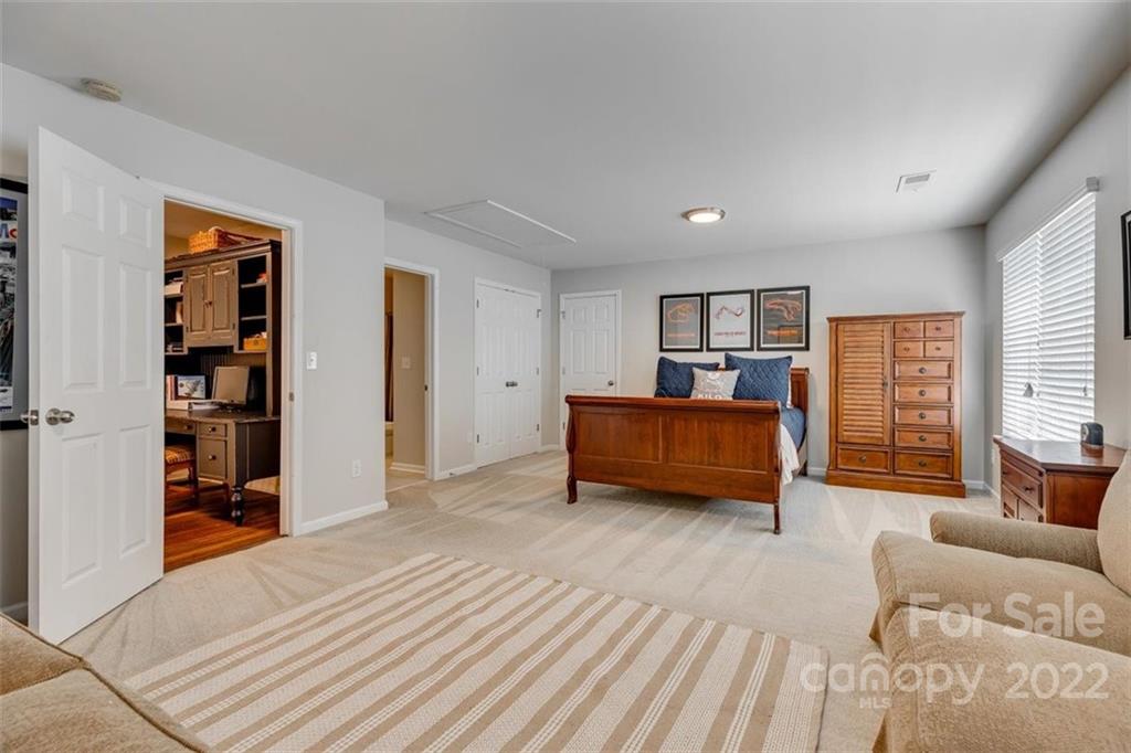 1007 Kaiser Way Fort Mill, SC 29715 - Photo 35 of 48 a bedroom with furniture and a wooden floor