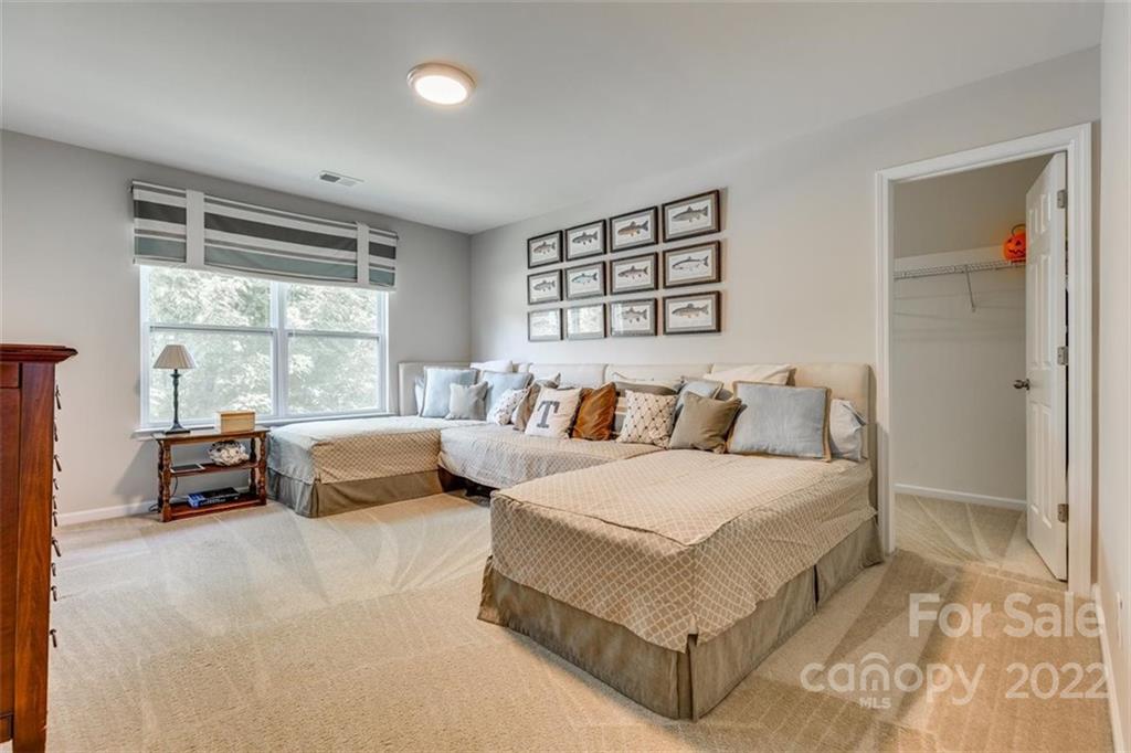 1007 Kaiser Way Fort Mill, SC 29715 - Photo 37 of 48 a spacious bedroom with a bed and a large window
