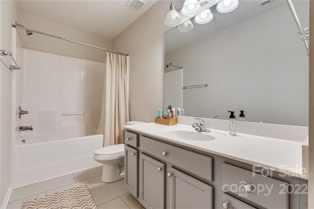 1007 Kaiser Way Fort Mill, SC 29715 - Photo 40 of 48 a bathroom with a sink a toilet and shower