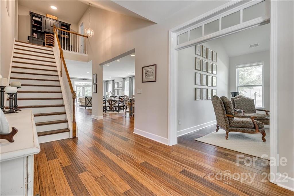 1007 Kaiser Way Fort Mill, SC 29715 - Photo 6 of 48 a view of a hallway with wooden floor and dining room