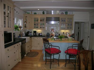 912 Spring Street Santa Rosa, CA 95404 - Photo 3 of 9 a kitchen with cabinets and chairs